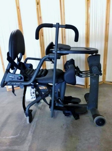 lot 7 image: WOW $6000 EasyStand EVOLV Standing Frame ADULT LARGE Wheelchair Physical Therapy Aid This One Has Extras  Wow Never Seen One With Roho Air Cushion Seat & Knee Pads Great Condition See YouTube