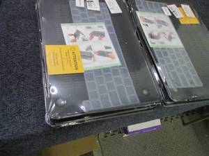 lot 25 image: 8 MacBook Pro Skin Cover...
