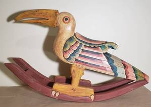 lot 103 image: Hand-carved Toucan Rocking Horse Sculpture