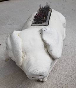 lot 85 image: Concrete Pig Boot Brush