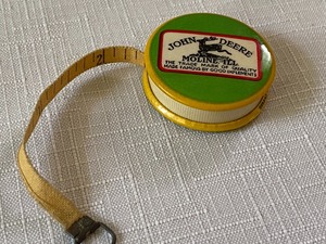 lot 24 image: Miniature John Deere Tape Measure