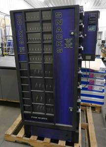 lot 24 image: Vending machine for both Soda and Snacks, great for a small office