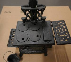lot 31 image: Mini Cast iron stove