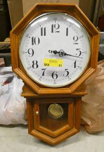 lot 51 image: Wood clock with pendulum, battery operated, works