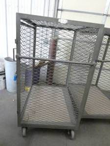 lot 131 image: Rolling Expanded Metal Cage with locking door - measures 30 w x 42 L x 57 tall