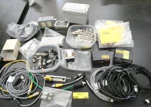lot 143 image: Lot of industrial automation Banner cables and photo sensors, 2 Microscan units, switch, enclosure box