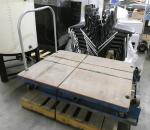 lot 152 image: 2 Large Warehouse Platform Carts 40x53 - have wheels front and back and large wheels in middle like a nutting cart, plywood top