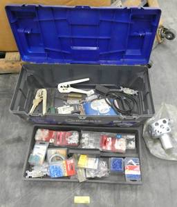 lot 169 image: Toolbox full of electrical supplies, wire nuts, staples, switches, wire strippers and crimpers, floor drain.  Toolbox is missing the latches