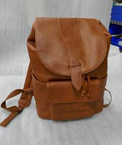 lot 204 image: Soft flap brown faux leather backpack with drawstring closure New