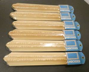 lot 218 image: Make your own picture frames - 6 packages 14 long each package has 2 pcs so it would make 3 frames total