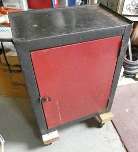 lot 219 image: Small tool box on wheels, door needs a pin in the front latch to stay closed