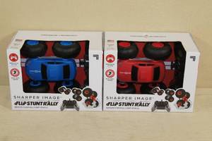 lot 72 image: Sharper Image Flip Stunt Rally Remote Control Cars