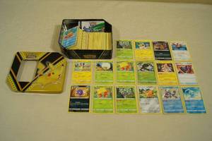 lot 124 image: Tin of Pokemon Cards - Shining Fates