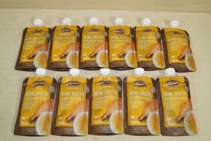 lot 162 image: Merrick Grain Free Bone Broth Dog Food Topper