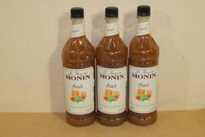 lot 183 image: Sirop de Monin Peach Flavoring