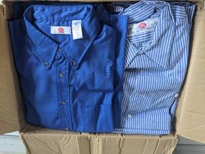 (29) Assorted Mens Work Clothes-(15) 2 XL Short-Sleeve Blue Button-Down Blue Shirt  (6) XL-Short-Sleeve Pinstriped White Button-Down Shirt  (5) 34 x 28 Navy Blue Pants  (2) 40 x 30 Navy Blue Pants  (1) 46 x 30 Navy Blue Pants