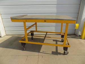 Steel work table on casters with stainless top