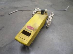 lot 90 image: NELSON RAIN TRAIN TRAVELING TRACTOR SPRINKLER - CAST IRON