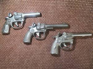 lot 106 image: 3 SMALL ANTIQUE CAST IRON CAP GUNS