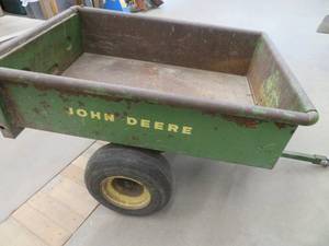 lot 125 image: JOHN DEERE 2 WHEELED TRAILER AND AN ANTIQUE AXE