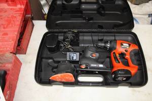 lot 743 image: Black & Decker 12V Cordless Firestorm Drill  with Attachments, Battery, Charger and Plastic Case