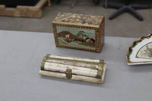 lot 905 image: Wood Mystery Opening Puzzle Box with Mt. FujiDogs, Scroll Box with Purple Interior circa 1800s