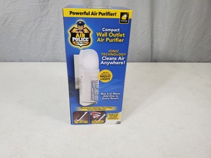 lot 17 image: New Air Police Compact Wall Outlet Air Purifier