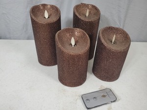 lot 79 image: 4 Brown Glitter Luminara Pillar Candles with Universal Remote