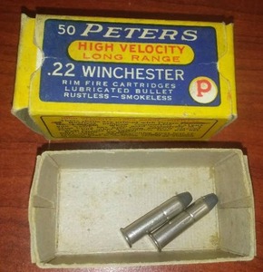 lot 19 image: 50 Peters, Vintage, .22 Winchester box and 2 bullets