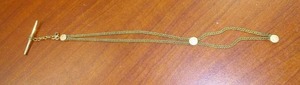 lot 53 image: WWI Gold colored chain  Uniform.