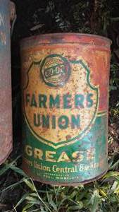 lot 222 image: Farmers Union 1 gallon grease car & more.