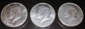 lot 116B image: 3 Kennedy 1976 (bicentennial) half dollar coins.