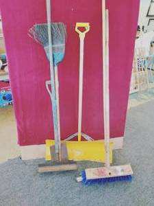 Collection of Shovels, Rakes, and Brooms