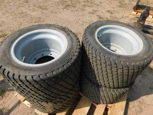 lot 17 image: Genie Litefoot Foamed Filled Turf Tires on 9 Hole Steel Rims