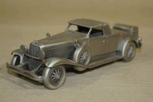 lot 32 image: Danbury Mint Pewter 1934 Duesenberg SJ Scale Car Model