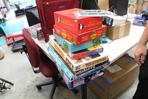 lot 511 image: Lot of (Approximately 8) Board Games  - The Inventors, Woodburning, Mad Scientist, Bermuda Triangle, Scattergories, Brontotsaurus Floor Puzzle, Desperate Housewives Dirty Laundry Game, Dart Set