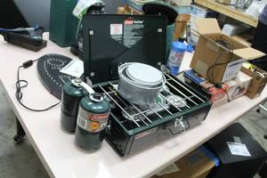 lot 556 image: Dual Fuel Camp Stove  with Propane Fuel Cans (x2), Cooking Pots (x2)