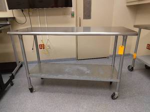 lot 4 image: MSRP $700 Advance Tabco ELAG-245 60 16 gauge Medical NSF Grade Mobile&nbspSurgical Instrument &nbspWork Table w Galvanized Steel Undershelf & 430 Series Stainless Flat Top On Wheels - Great Condition