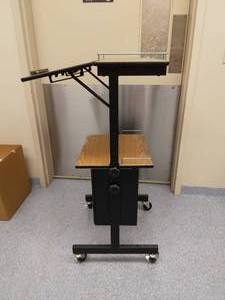 lot 5 image: MSRP $200 Wood Grain Multi-Level Tilting Height Adjustable Sit Stand Computer Work-Station Podium Mobile Cart With Lower Printer Shelf & Metal Rail Guards - Great Condition