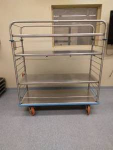 lot 18 image: MSRP $3200&nbspMedical Grade Stainless Steel&nbspMobile Storage 4 Solid Flat Steel Shelves Transport Medical Exchange Cart With Bumper Guards, Rubber Casters & Locking Brakes - Great Condition
