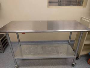 lot 24 image: MSRP $700 Advance Tabco ELAG-245 60 16 gauge Medical NSF Grade Mobile&nbspSurgical Instrument &nbspWork Table w Galvanized Steel Undershelf & 430 Series Stainless Flat Top On Wheels - Great Condition