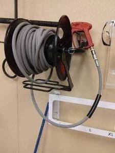 lot 52 image: Hotsy Pressure Washer Red Trigger Gun (Can handle 5000psi), Wand, Hose & Wall Mount Rack Only - Great Condition - No Pressure Washer Mechanism (Had been wired into building) 