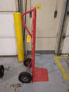 lot 56 image: MSRP$125 ULine  Loop Handle Steel Hand Truck - XL Nose Plate, Solid Wheels Built-to-last, heavy-duty workhorses.  16 x 13 nose plate for oversized loads. Control tall loads with one hand -Great Condition