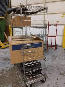lot 68 image: MSRP $400 Industrial Grade 4 Shelf Wire Storage Rack Cart With Reinforced Sides With Swivel Rubber Casters - Great Condition  Contents Not Included