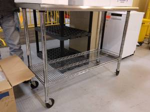 lot 70 image: MSRP $700 Medical NSF Grade Mobile Stainless Steel Surgical Instrument Table with Wire Rack On Wheels - Great Sturdy Condition With Signs Of Wear To Legs Etc - Suitable For Clinics, Laboratories, Kitchen, Restaurants & Food Production