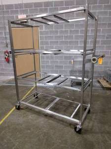 lot 104 image: MSRP $2000 Stainless Steel Shelving Cart For Animal Caging Transport - Great Condition