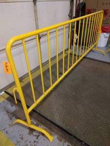 lot 58 image: MSRP $200 Yellow Powder Coated Steel Crowd Control Barrier - Easy To Move Around & Very Sturdy - Excellent Condition