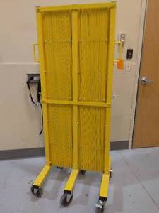 lot 64 image: MSRP $400 ULine H-7604 Safety Barricade Gates-Heavy-duty barrier prevents access to restricted areas in warehouses or wholesale clubs.