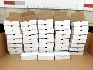 lot 212 image: Lot of 43 Uline White Indestructo Mailer Boxes