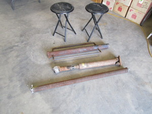 lot 89 image: Post Pounder, Stools, Driveshaft, Garage Door Spring